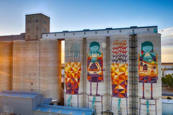 Coloujr image of grain silos with artwork on outside of Silos